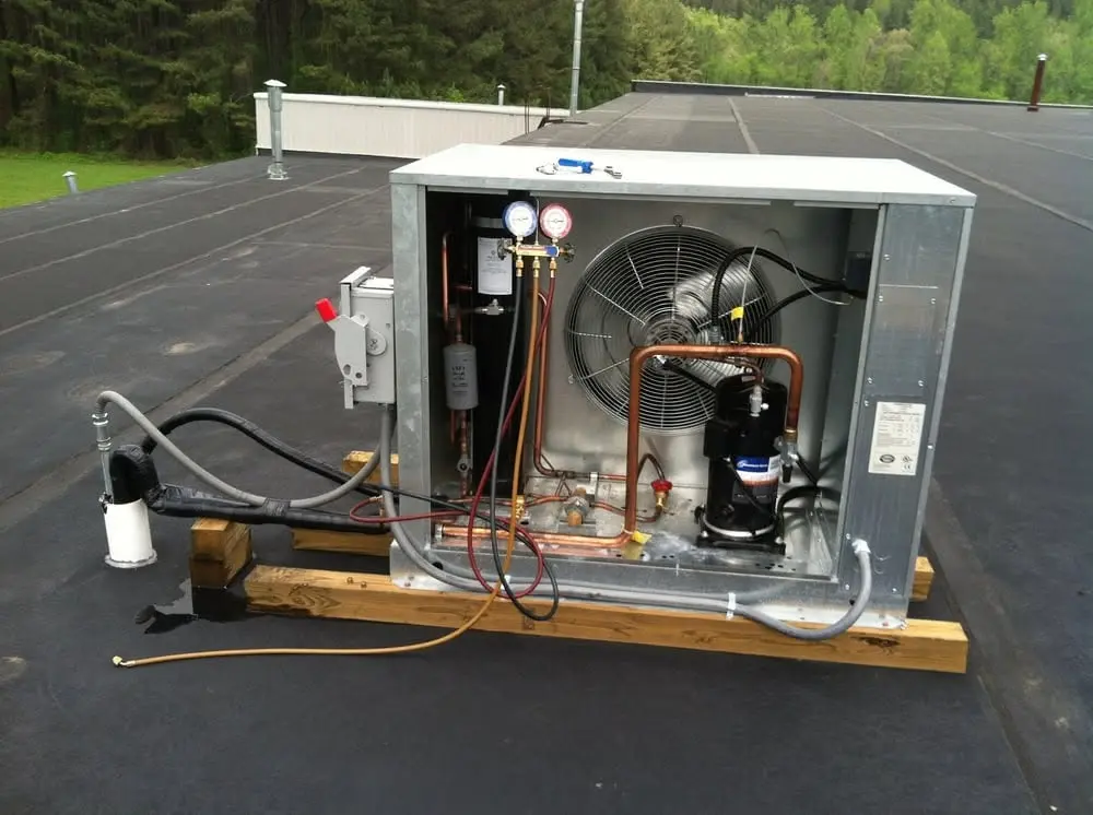 Commercial refrigeration rooftop equipment being serviced